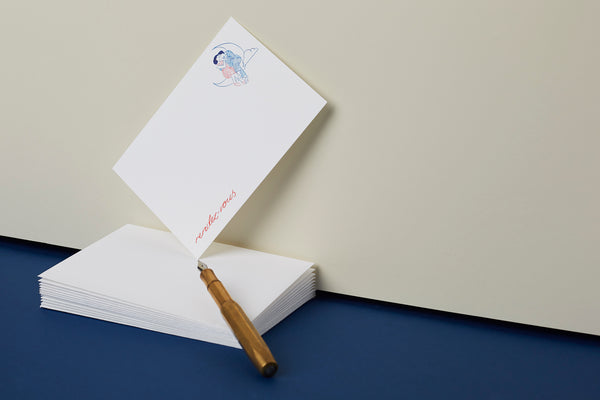 Billets Doux with pen and blue background